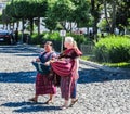 View of Indigenous Mayan women walking in the street in the city center of Antigua, Guatemala
