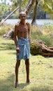 Indigenous old man walikng stick Kerala India