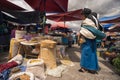 Indigenous quechua woman dressed traditionally in Otavalo Ecuador farmers market