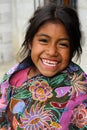 An indigenous Tzotzil Maya girl smiling outside her home in a ZinacantÃÂ¡n near San Cristobal de la Casas, Mexico