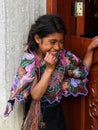 An indigenous Tzotzil Maya girl smiling outside her home in a ZinacantÃÂ¡n near San Cristobal de la Casas, Mexico