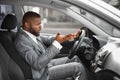 Indignant african man driver gesturing and shouting while driving car Royalty Free Stock Photo