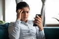 Indignant unhappy Indian woman looking at smartphone screen Royalty Free Stock Photo