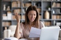 Indignant woman reading letter received bad news from bank Royalty Free Stock Photo