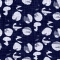 Indigo blue batik dyed effect dotty texture background. Seamless japanese style repeat pattern swatch. Painterly circle Royalty Free Stock Photo