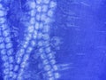 Indigo blue fabric tie dye pattern background.