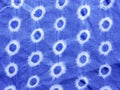 Indigo blue fabric tie dye pattern background.