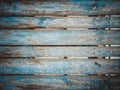 Indigo blue wooden planks background. Colourful fence deteriorated by time.