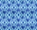 Indigo dyed textile seamless pattern. Repeatable ikat style ornament