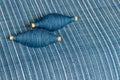 Indigo dyed yarn in reel and indigo dyed woven fabric background Royalty Free Stock Photo