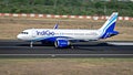 Indigo flight taxying back to terminal on runway Royalty Free Stock Photo