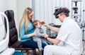 Indirect ophthalmoscope. Retinal examination. Fundoscopy. Child vision test. Royalty Free Stock Photo