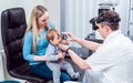 Indirect ophthalmoscope. Retinal examination. Fundoscopy. Child vision test. Royalty Free Stock Photo