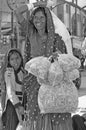 Indian woman with her daughter and herbal tea bags in her hand Royalty Free Stock Photo