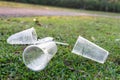 PVC cups litter on public park pose danger to environment Royalty Free Stock Photo