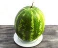 Indispensable fruit of summer months watermelon, waiting for you to be cut with a knife