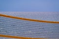 Indistinct grid of beach volleyball closeup