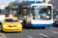 Indistinct photo yellow car taxi and bus or trolleybus closeup