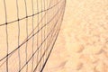 Indistinct volleyball grid against background of sand