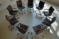 individual arranging office chairs in a circle for a meetandgreet Royalty Free Stock Photo