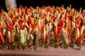 Individual Cocktail shot glasses with sticks of carrot, cucumber and spicy sauce