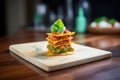 individual lasagna portion on a wooden board Royalty Free Stock Photo