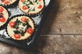 Individual mini quiche pies just before being cooked in the oven