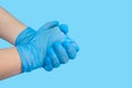 Individual protection products vinyl disposable gloves in the spread of virus and protection against infections. Women `s hands in
