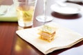 individual serving of foie gras toast on a cocktail napkin