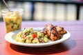 individual serving of potato salad with a side of grilled chicken