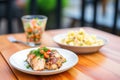 individual serving of potato salad with a side of grilled chicken