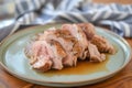 individual serving sousvide cooked pork onto a dinner plate Royalty Free Stock Photo