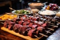 individual skewering different meats for brazilian bbq