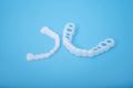 Individual teeth tray for whitening on blue background