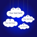 Individual white clouds on gray threads, on a blue background, space for your text Royalty Free Stock Photo