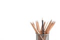 Individuality concept - black pencil surrounded by wooden brown pencils Royalty Free Stock Photo