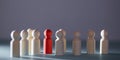 Individuality, personal identity mockup. Not like everyone. Stand out from crowd. Wooden figures, red person miniature