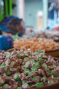 Individually Wrapped Candies in Wooden Bowl at Market Royalty Free Stock Photo