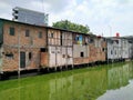 Indomaret, Roxy mas, JSlum dwellings that are usually occupied by underprivileged residents