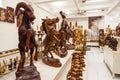 Indonesain handmade wood figures stands in a shelf