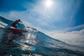 Indonesia, Bali, July 13 2016: A male surfer riding big blue oce Royalty Free Stock Photo