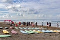 Surfing school students with their boards on the shores of the Andaman sea