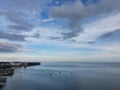 Indonesia, Balikpapan city bay, view from hotel balcony, bue ocean sea water with calm waves and cloudy sky horizon visible in the Royalty Free Stock Photo