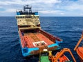 Offshore supply tug vessel close engaged in towing operations