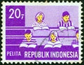 INDONESIA - CIRCA 1969: A stamp printed in Indonesia shows Children in class Education, circa 1969.