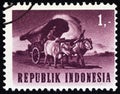 INDONESIA - CIRCA 1964: A stamp printed in Indonesia from the `Transport and Traffic` issue shows Ox cart, circa 1964.