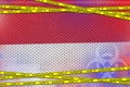 Indonesia flag and Covid-19 quarantine yellow tape. Coronavirus or 2019-nCov virus concept