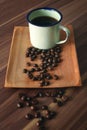 Coffee cup and Indonesia coffee beans on table