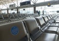 INDONESIA, ISLAND LOMBOK-MARCH 28, 2020: empty rows of seats in the airport lounge during the coronavirus pandemic. Close-up warni