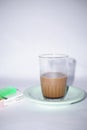 indonesia, jakarta, 2023 february 27, a glass of coffee and a pack of cigarettes, is on the table, Royalty Free Stock Photo